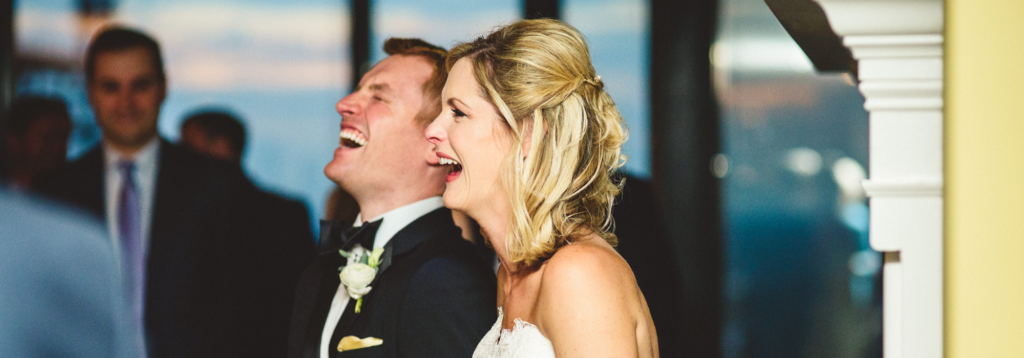Couple Laughing with their Fun Wedding DJ and Master of Ceremonies during their Love Story from wedding DJ company Remarkable Receptions